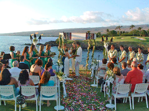 Members of Kona's Traveling Jewish Wedding Band perform for arriving guests as Gloria stands beneath the chuppah